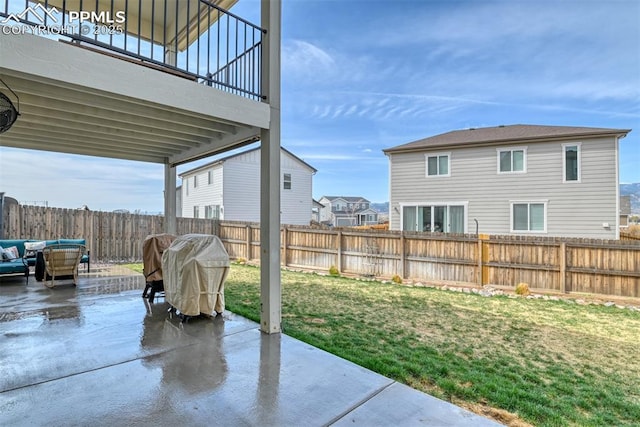 view of patio featuring a fenced backyard and a grill