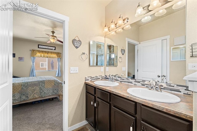 7814 Dry Willow Way, Colorado Springs, CO 80908 - bathroom with double vanity, a sink, a ceiling fan, and connected bathroom