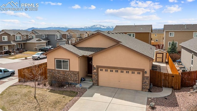 7814 Dry Willow Way, Colorado Springs, CO 80908 - view of front of home with driveway, fence, a residential view, and stucco siding