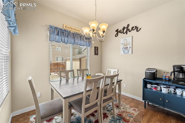 7814 Dry Willow Way, Colorado Springs, CO 80908 - dining area with baseboards, a chandelier, and wood finished floors