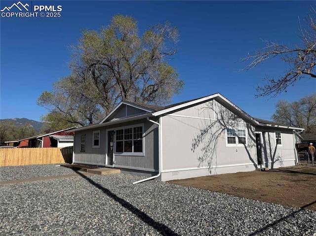 view of side of property with fence