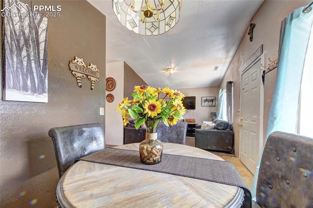 dining space with a chandelier