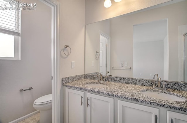 5033 Baseline Vw, Colorado Springs, CO 80920 - bathroom featuring toilet and double vanity