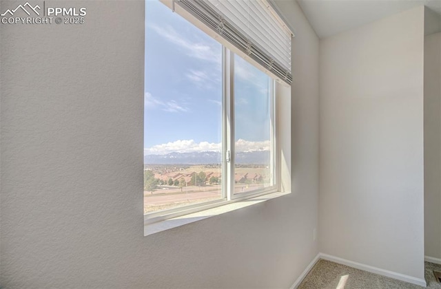 5033 Baseline Vw, Colorado Springs, CO 80920 - unfurnished room featuring plenty of natural light, baseboards, and carpet floors