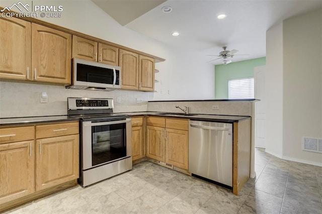 5584 Sonnet Hts, Colorado Springs, CO 80918 - kitchen with backsplash, dark countertops, visible vents, stainless steel appliances, and a sink