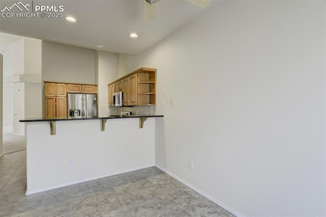5584 Sonnet Hts, Colorado Springs, CO 80918 - kitchen featuring baseboards, open shelves, dark countertops, appliances with stainless steel finishes, and a breakfast bar area