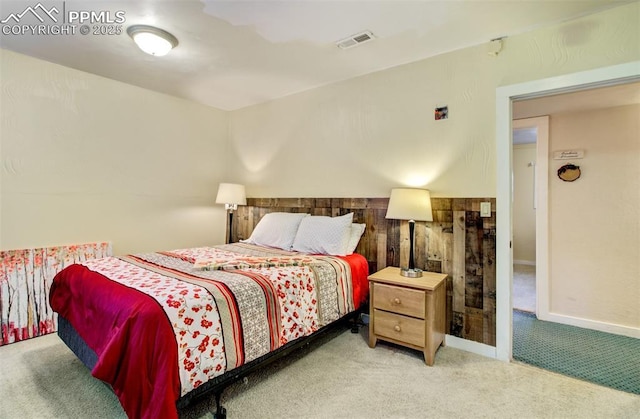 bedroom with carpet floors and visible vents