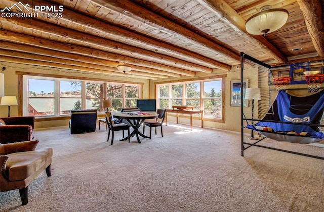 interior space featuring beamed ceiling, carpet flooring, and wood ceiling