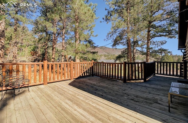 wooden terrace with a mountain view