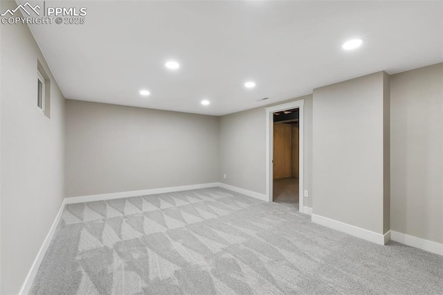 finished basement with recessed lighting, baseboards, and light carpet