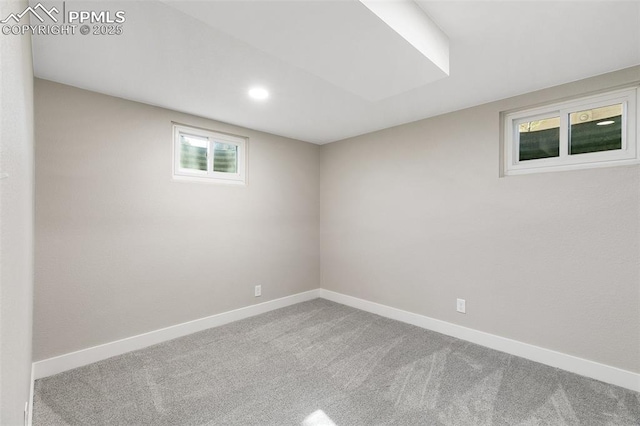 below grade area featuring baseboards, carpet floors, and recessed lighting