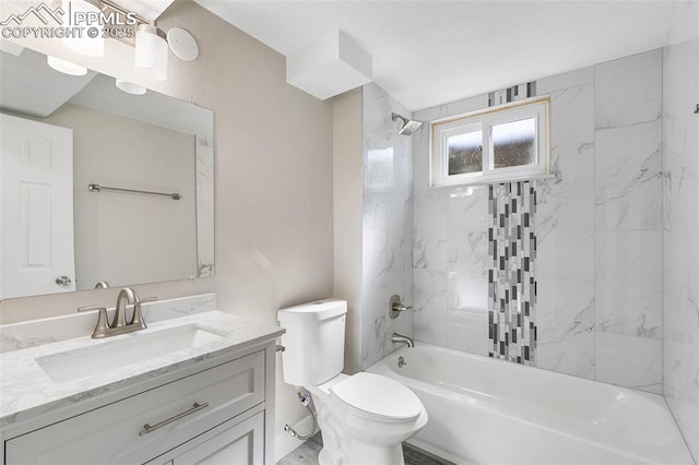 bathroom featuring toilet, vanity, and washtub / shower combination