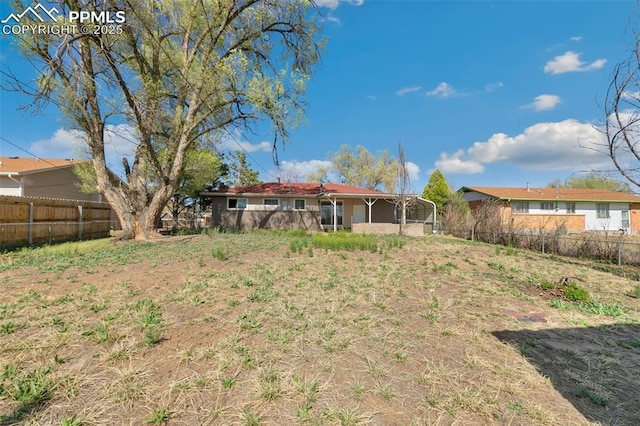 view of yard featuring fence
