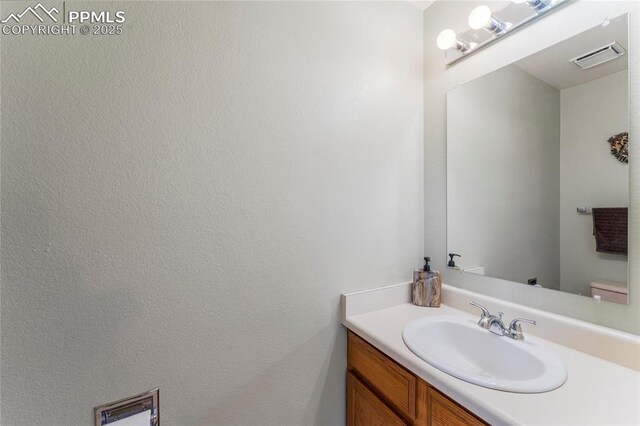 1951 Giltshire Dr, Colorado Springs, CO 80905 - half bath with toilet, vanity, and visible vents