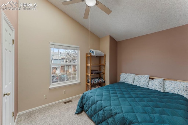 1951 Giltshire Dr, Colorado Springs, CO 80905 - carpeted bedroom featuring ceiling fan, a textured ceiling, vaulted ceiling, visible vents, and baseboards