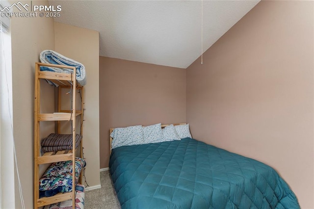 1951 Giltshire Dr, Colorado Springs, CO 80905 - bedroom featuring baseboards, carpet flooring, and lofted ceiling