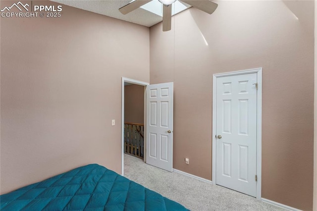 1951 Giltshire Dr, Colorado Springs, CO 80905 - unfurnished bedroom with a high ceiling, baseboards, a ceiling fan, and carpet
