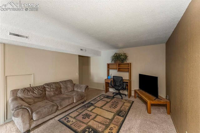 1951 Giltshire Dr, Colorado Springs, CO 80905 - carpeted living area with a textured ceiling and visible vents