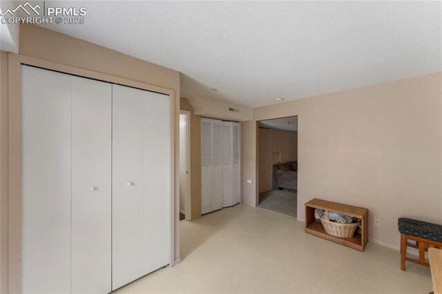 1951 Giltshire Dr, Colorado Springs, CO 80905 - interior space featuring visible vents, multiple closets, and baseboards