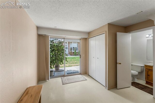 1951 Giltshire Dr, Colorado Springs, CO 80905 - doorway to outside featuring a textured ceiling