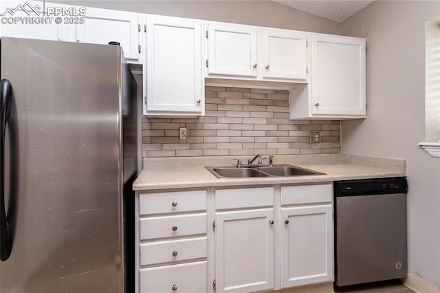 138 Hoedown Cir, Fountain, CO 80817 - kitchen featuring light countertops, white cabinets, decorative backsplash, stainless steel appliances, and a sink
