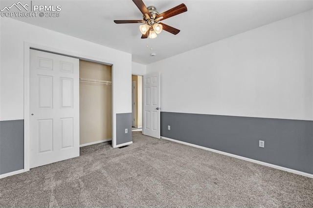 unfurnished bedroom with a ceiling fan, baseboards, a closet, and carpet