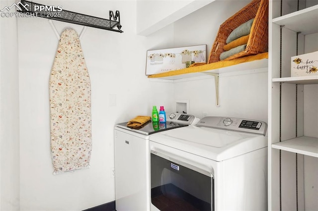 laundry room with laundry area and washing machine and clothes dryer