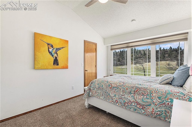 bedroom with baseboards, ceiling fan, carpet, a textured ceiling, and vaulted ceiling