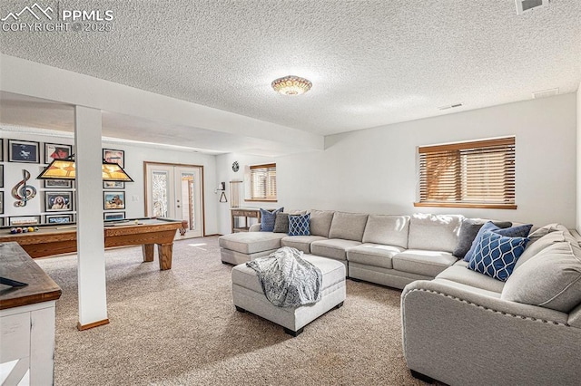 living area with visible vents, a textured ceiling, carpet floors, billiards, and french doors