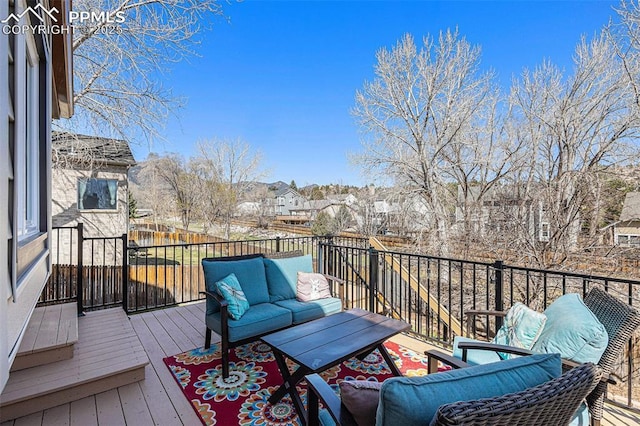 wooden deck featuring a residential view and an outdoor hangout area