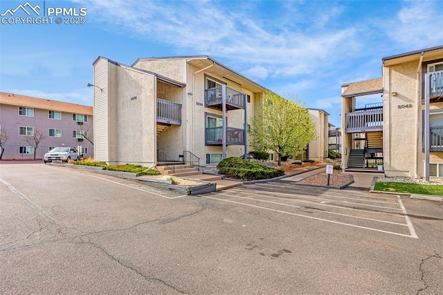 5030 El Camino Dr Unit 1, Colorado Springs, CO 80918 - view of property featuring uncovered parking