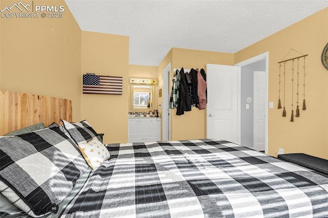5030 El Camino Dr Unit 1, Colorado Springs, CO 80918 - bedroom with ensuite bathroom and a textured ceiling