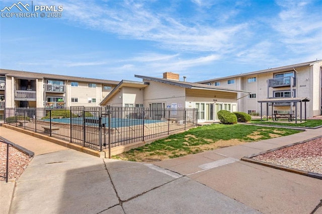 5030 El Camino Dr Unit 1, Colorado Springs, CO 80918 - view of community with a swimming pool and fence