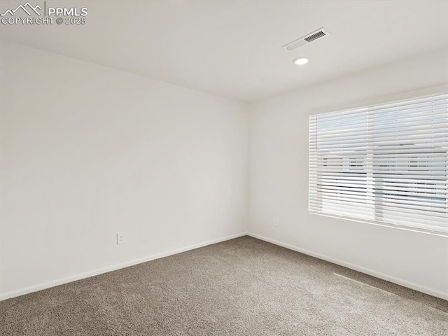 unfurnished room with baseboards, visible vents, recessed lighting, and carpet flooring