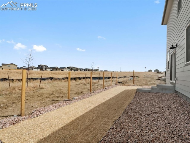 view of yard with fence