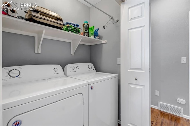 4626 Hotspur Dr, Colorado Springs, CO 80922 - laundry room with washing machine and clothes dryer, baseboards, visible vents, wood finished floors, and laundry area