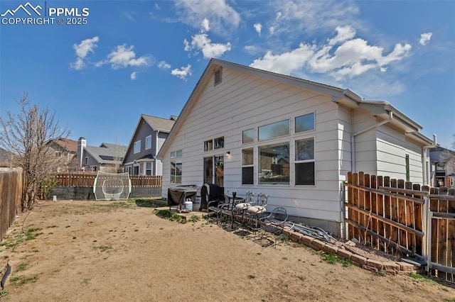 4626 Hotspur Dr, Colorado Springs, CO 80922 - rear view of house featuring a fenced backyard
