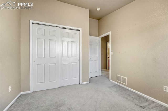 5542 Sunshade Pt, Colorado Springs, CO 80923 - unfurnished bedroom with visible vents, baseboards, a closet, and carpet floors