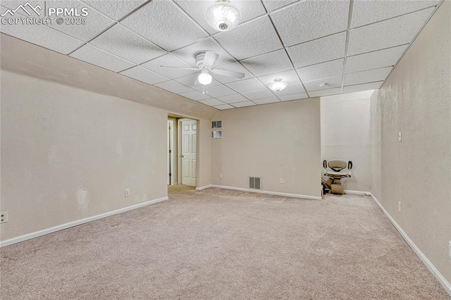 5542 Sunshade Pt, Colorado Springs, CO 80923 - basement with visible vents, baseboards, a paneled ceiling, and carpet floors