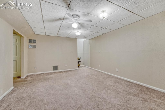 5542 Sunshade Pt, Colorado Springs, CO 80923 - carpeted spare room with ceiling fan, baseboards, a drop ceiling, and visible vents