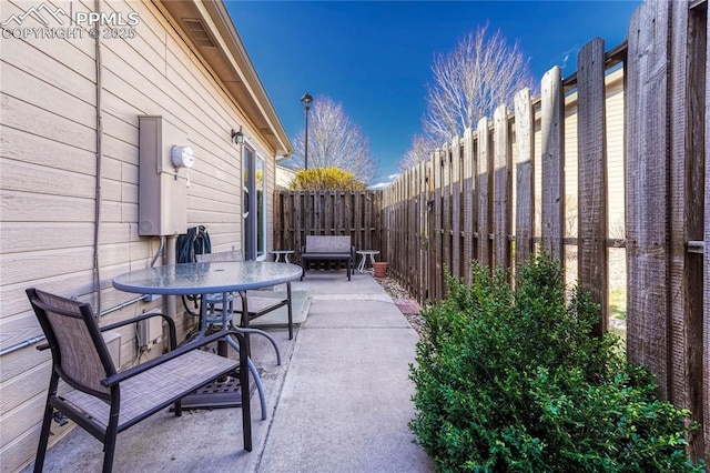 5542 Sunshade Pt, Colorado Springs, CO 80923 - view of patio / terrace with outdoor dining area and a fenced backyard