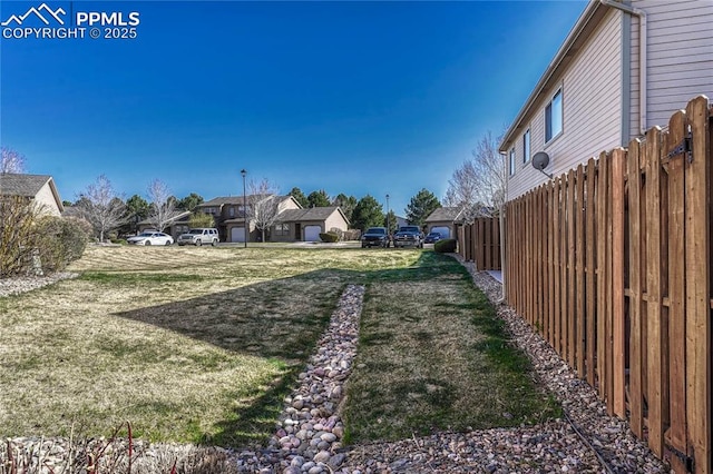 5542 Sunshade Pt, Colorado Springs, CO 80923 - view of yard with a residential view and fence