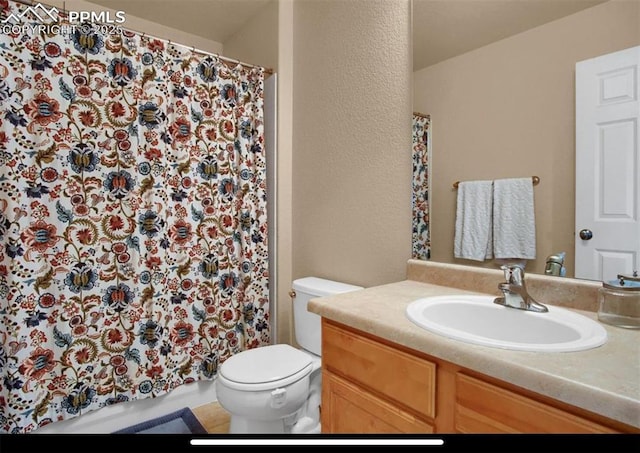8723 Stony Creek Dr, Colorado Springs, CO 80924 - bathroom featuring toilet, vanity, a shower with shower curtain, and a textured wall