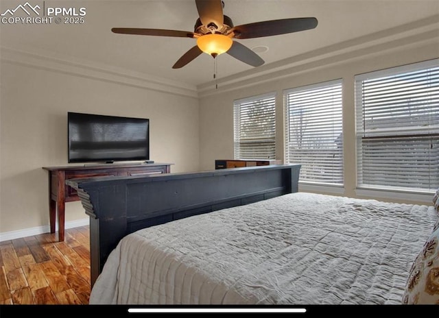 8723 Stony Creek Dr, Colorado Springs, CO 80924 - bedroom with wood finished floors, baseboards, and ceiling fan
