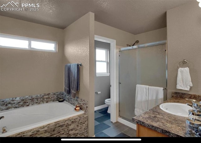 8723 Stony Creek Dr, Colorado Springs, CO 80924 - full bathroom with healthy amount of natural light, toilet, a shower stall, a textured ceiling, and a garden tub