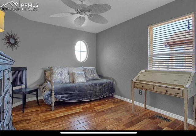 8723 Stony Creek Dr, Colorado Springs, CO 80924 - bedroom with wood finished floors, baseboards, and ceiling fan
