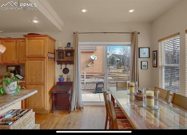 8723 Stony Creek Dr, Colorado Springs, CO 80924 - dining space with healthy amount of natural light, light wood-style floors, and recessed lighting