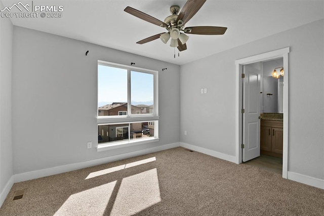 unfurnished bedroom featuring baseboards, visible vents, and carpet floors
