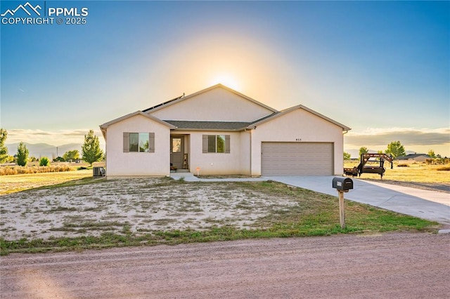 955 S Los Charros Dr, Pueblo West, CO 81007 - single story home featuring central air condition unit, driveway, stucco siding, and an attached garage