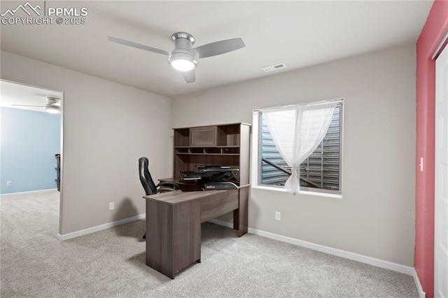 955 S Los Charros Dr, Pueblo West, CO 81007 - home office featuring baseboards, visible vents, light colored carpet, and a ceiling fan